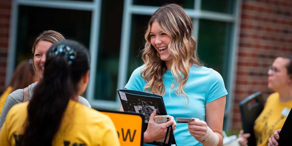 A student is all smiles during Black and Gold week and MU